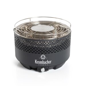Rauchfreier Grill von Krombacher mit rundem schwarzen Gehäuse und Edelstahl-Grillrost