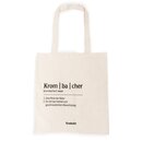 Beiger Jutebeutel mit schwarzem Text in Lautschrift 'Krom|ba|cher' und Definitionen, darunter 'Eine Perle der Natur' und 'Ein Ort der Vielfalt und geschmacklichen Abwechslung', Marke Krombacher.